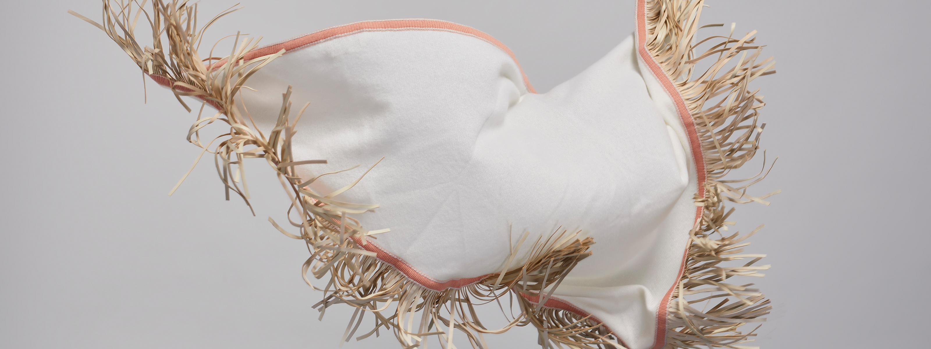 Antonia Zander Triangolo cashmere scarf with leather fringes, flowing in motion.