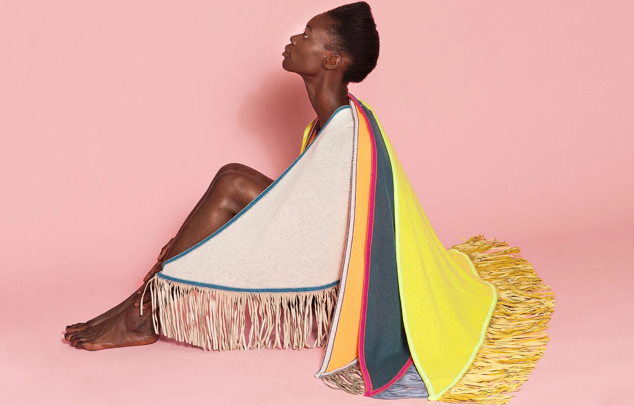 Antonia Zander Triangolo multicolor cashmere scarf with leather fringes, worn draped over the body.