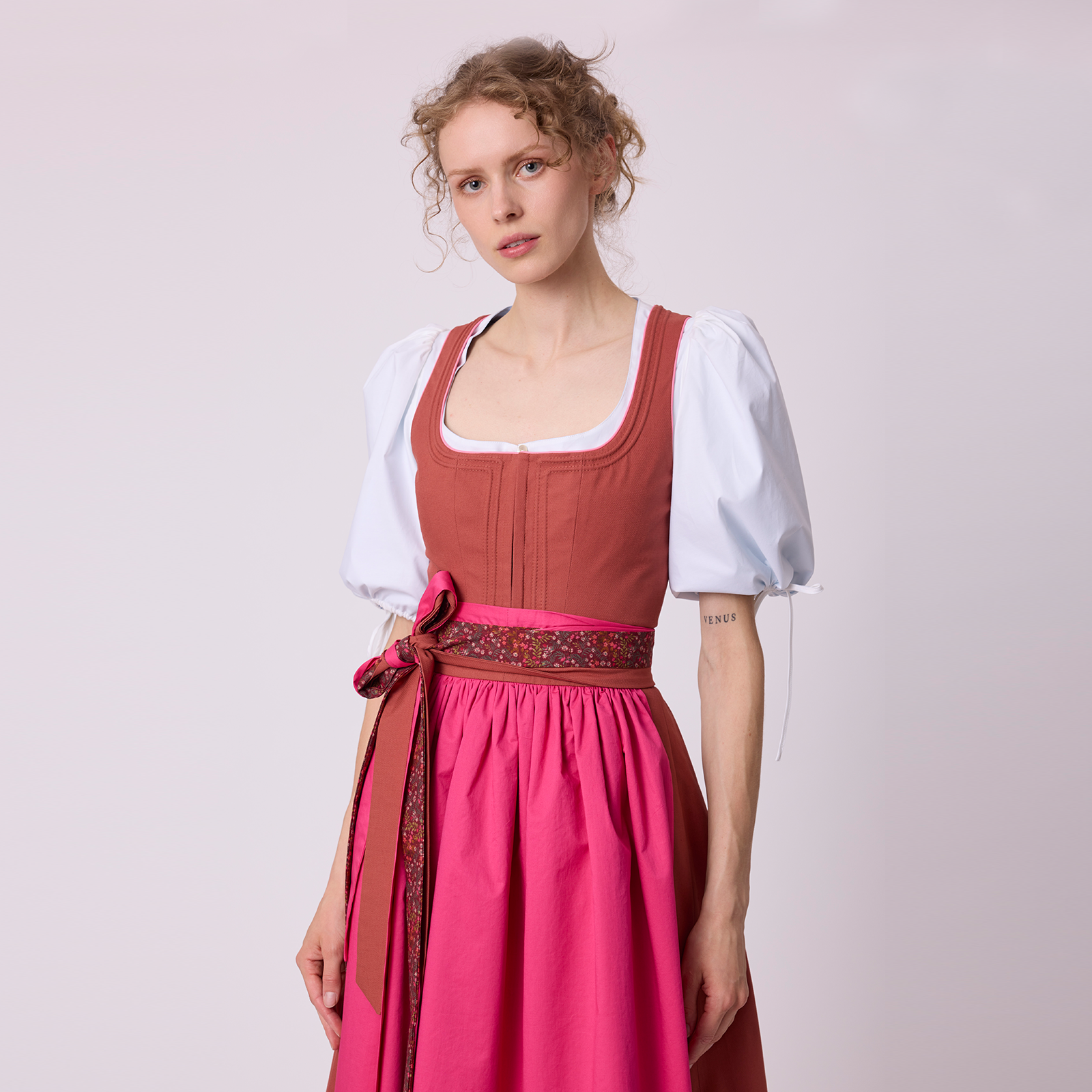 Pink dirndl by Antonia Zander, combining traditional craftsmanship with a modern silhouette.