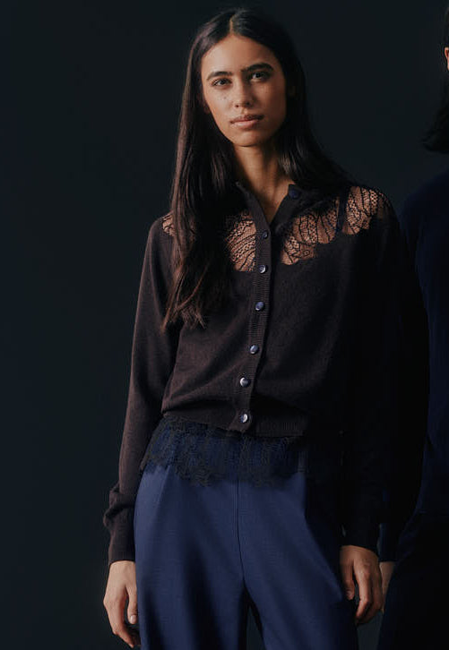 Model wearing the Antonia Zander Peppa Cardigan crafted from finest Italian cashmere with delicate lace inserts, styled with navy tailored Raya pantsuit.